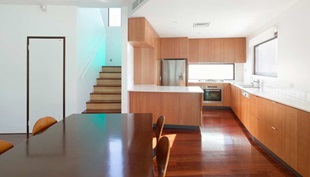 The tapering kitchen joinery.
